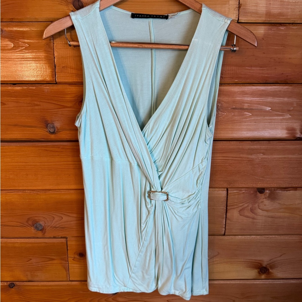 Ivanka Trump - mint green cotton blouse with rhinestone buckle at the waist